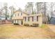 Two-story house with beige siding, dark-blue shutters, and a yard at 2211 Green Forrest Dr, Decatur, GA 30032