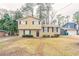 Two-story house with beige siding, dark-blue shutters, and a well-maintained lawn at 2211 Green Forrest Dr, Decatur, GA 30032