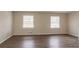 Spacious living room featuring hardwood-look vinyl flooring and neutral walls at 2211 Green Forrest Dr, Decatur, GA 30032