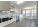 Eat-in kitchen with white cabinets, stainless steel appliances, and a bay window at 3088 Fox Chase Ct, Snellville, GA 30039