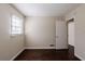 Simple bedroom with hardwood floors and access to a hallway at 3582 Swallow Ln, Decatur, GA 30032