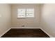 Bright bedroom with dark hardwood floors and ample closet space at 3582 Swallow Ln, Decatur, GA 30032