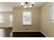 Dining area with hardwood floors, chandelier and window at 3582 Swallow Ln, Decatur, GA 30032