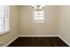 Simple dining room with dark hardwood floors and neutral walls at 3582 Swallow Ln, Decatur, GA 30032