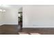 Bright dining room with dark hardwood floors and view into kitchen at 3582 Swallow Ln, Decatur, GA 30032