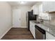 Modern kitchen with granite countertops and stainless steel appliances at 3582 Swallow Ln, Decatur, GA 30032