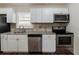 Renovated kitchen with granite countertops and stainless steel appliances at 3582 Swallow Ln, Decatur, GA 30032