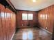 The bedroom showcases natural wood paneling and hardwood floors, creating a warm, inviting space at 6070 Blackhawk Se Trl, Mableton, GA 30126