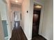 Hallway with hardwood floors connecting various rooms in the home at 6070 Blackhawk Se Trl, Mableton, GA 30126