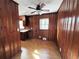Cozy kitchen with wood-paneled walls, cork floors, and a vintage aesthetic at 6070 Blackhawk Se Trl, Mableton, GA 30126