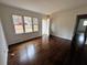 Bright living room featuring hardwood floors, white walls, and lots of natural light at 6070 Blackhawk Se Trl, Mableton, GA 30126