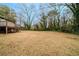 Large backyard with deck and surrounding trees at 3693 Aldea Dr, Decatur, GA 30032