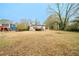 Backyard view of house with deck and trees at 3693 Aldea Dr, Decatur, GA 30032