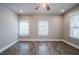 Spacious bedroom with hardwood floors and multiple windows at 3693 Aldea Dr, Decatur, GA 30032