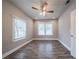 Well-lit bedroom with hardwood floors and ceiling fan at 3693 Aldea Dr, Decatur, GA 30032