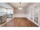 Dining room with hardwood floors, chandelier, and kitchen views at 3693 Aldea Dr, Decatur, GA 30032
