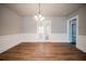 Bright dining room with hardwood floors and french doors at 3693 Aldea Dr, Decatur, GA 30032