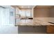 Modern kitchen with granite countertops and breakfast bar at 3693 Aldea Dr, Decatur, GA 30032