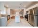Open concept kitchen with island and stainless steel appliances at 3693 Aldea Dr, Decatur, GA 30032