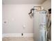 Laundry room with vinyl flooring and water heater at 3693 Aldea Dr, Decatur, GA 30032