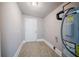 Laundry room with vinyl flooring, water heater and door at 3693 Aldea Dr, Decatur, GA 30032
