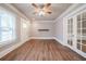Bright living room featuring hardwood floors and french doors at 3693 Aldea Dr, Decatur, GA 30032
