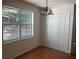 Dining area with hardwood floors, window, and built-in storage at 7115 Shady Oak Ln, Cumming, GA 30040