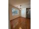 Bright dining room with hardwood floors and a view to the backyard at 7115 Shady Oak Ln, Cumming, GA 30040