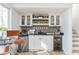 Stylish home bar with white cabinets, wood accents, and a beverage fridge at 981 Fairfield Dr, Marietta, GA 30068