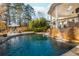 Inviting kidney-shaped pool with cascading waterfall feature at 981 Fairfield Dr, Marietta, GA 30068