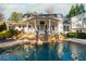 Luxury pool, patio, and waterfall feature at 981 Fairfield Dr, Marietta, GA 30068