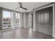 Spacious bedroom with hardwood floors and large windows at 244 Castleberry Station Sw Dr, Atlanta, GA 30313