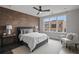 Charming bedroom with brick accent wall and hardwood floors at 244 Castleberry Station Sw Dr, Atlanta, GA 30313
