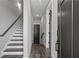 Modern hallway with staircase and dark wood flooring at 244 Castleberry Station Sw Dr, Atlanta, GA 30313