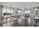 Open living room with hardwood floors and large windows at 244 Castleberry Station Sw Dr, Atlanta, GA 30313