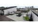 Spacious rooftop deck with city views, comfortable seating, and grill at 244 Castleberry Station Sw Dr, Atlanta, GA 30313
