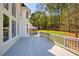Expansive back deck offering stunning views of the verdant backyard at 701 Vinings Estates Se Dr, Smyrna, GA 30126
