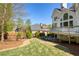 Spacious backyard showing the back of the home, deck, and landscaped yard at 701 Vinings Estates Se Dr, Smyrna, GA 30126