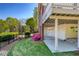 Backyard view of the home featuring a small patio and beautiful azaleas at 701 Vinings Estates Se Dr, Smyrna, GA 30126