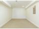 Spacious basement provides ample storage with neutral carpet flooring at 701 Vinings Estates Se Dr, Smyrna, GA 30126