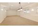 Finished basement with carpet, recessed lighting and several large windows at 701 Vinings Estates Se Dr, Smyrna, GA 30126