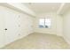 Well-lit basement features tile flooring, two large closets, and a window at 701 Vinings Estates Se Dr, Smyrna, GA 30126