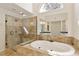 Bright bathroom with soaking tub, glass shower, and dual vanities provides a spa-like experience at 701 Vinings Estates Se Dr, Smyrna, GA 30126