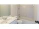 Bathroom featuring a vanity and a tub with a shower at 701 Vinings Estates Se Dr, Smyrna, GA 30126