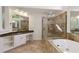 Well-appointed bathroom featuring a soaking tub and a frameless glass shower at 701 Vinings Estates Se Dr, Smyrna, GA 30126