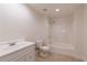 Clean, bright bathroom featuring a vanity, toilet, and shower-tub combo at 701 Vinings Estates Se Dr, Smyrna, GA 30126