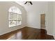 Bedroom with wood floors, vaulted ceiling, and an arched window at 701 Vinings Estates Se Dr, Smyrna, GA 30126