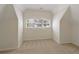 Bedroom with neutral carpet, vaulted ceilings, and large windows at 701 Vinings Estates Se Dr, Smyrna, GA 30126