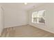 Bedroom featuring neutral carpet and two large windows at 701 Vinings Estates Se Dr, Smyrna, GA 30126