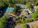 Aerial view showcasing the community pool, clubhouse, and parking area at 701 Vinings Estates Se Dr, Smyrna, GA 30126